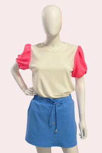 White textured top with neon pink puff sleeves