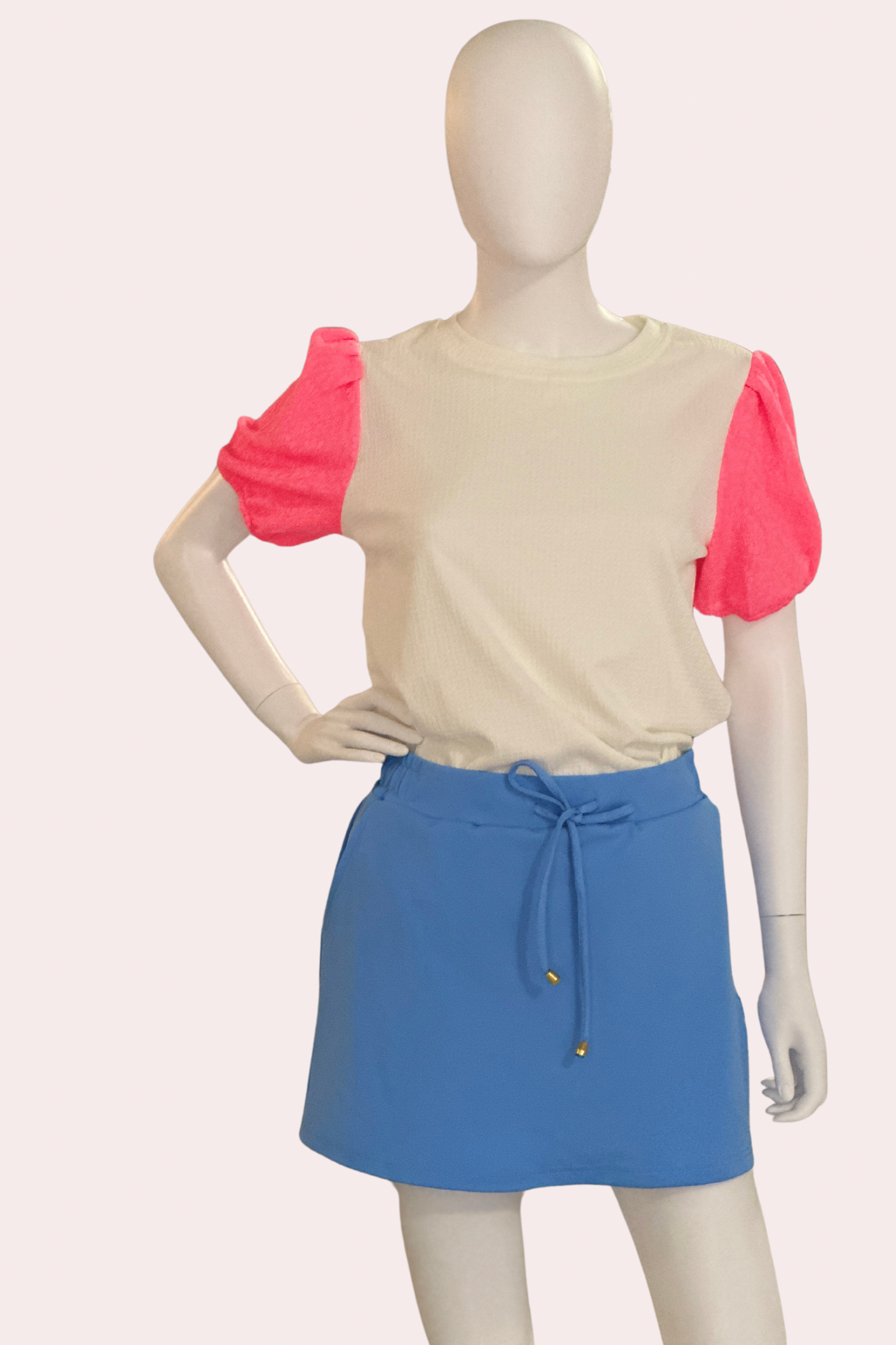 White textured top with neon pink puff sleeves