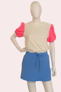 White textured top with neon pink puff sleeves