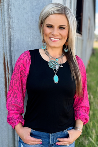 Black top with pink bubble sleeves