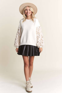 Off white sweater top with faux fur sequin sleeves