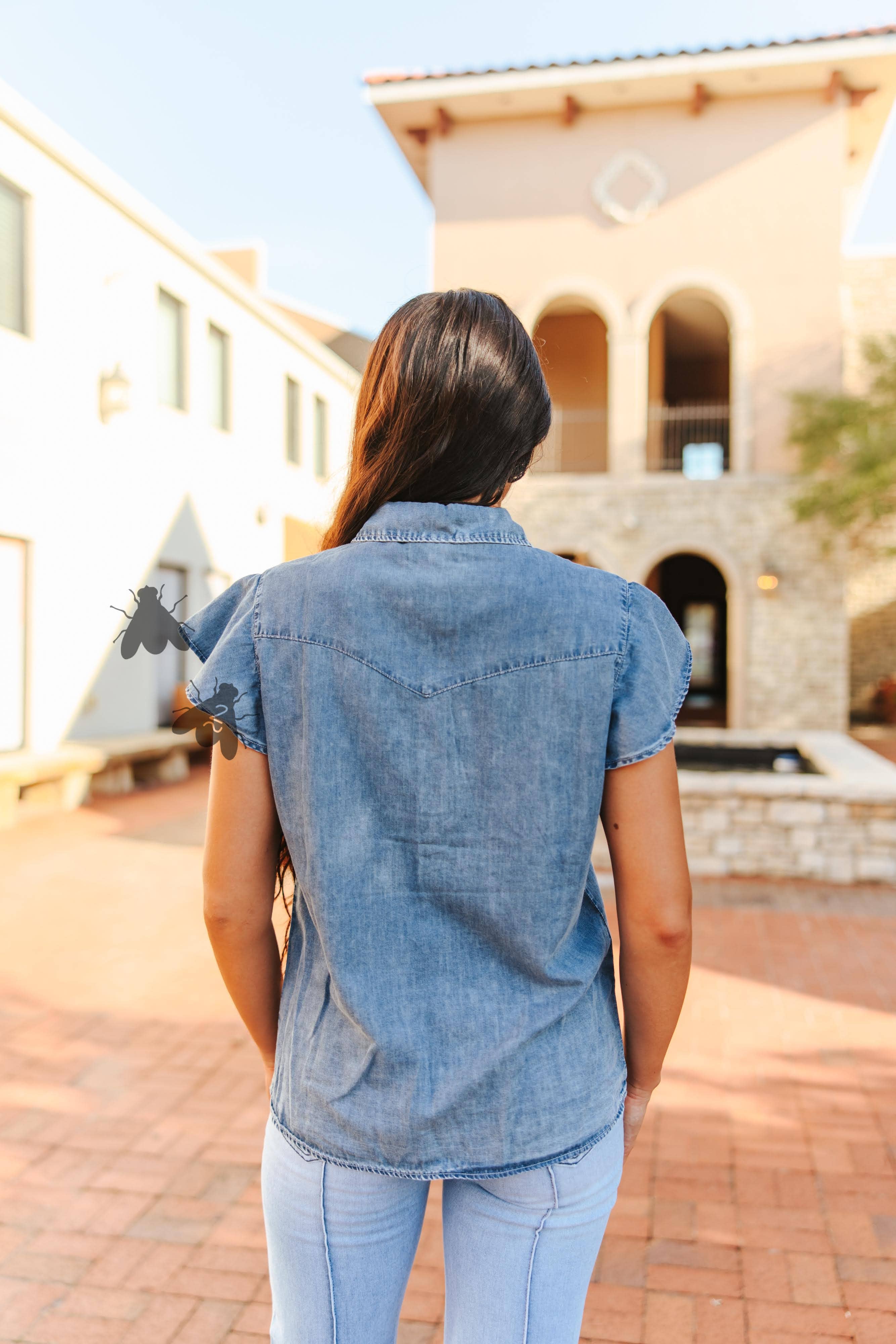 Denim top with pearl snap buttons