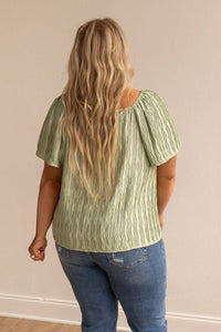 Green short sleeve silk top
