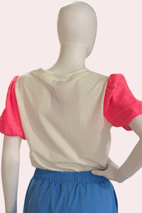 White textured top with neon pink puff sleeves