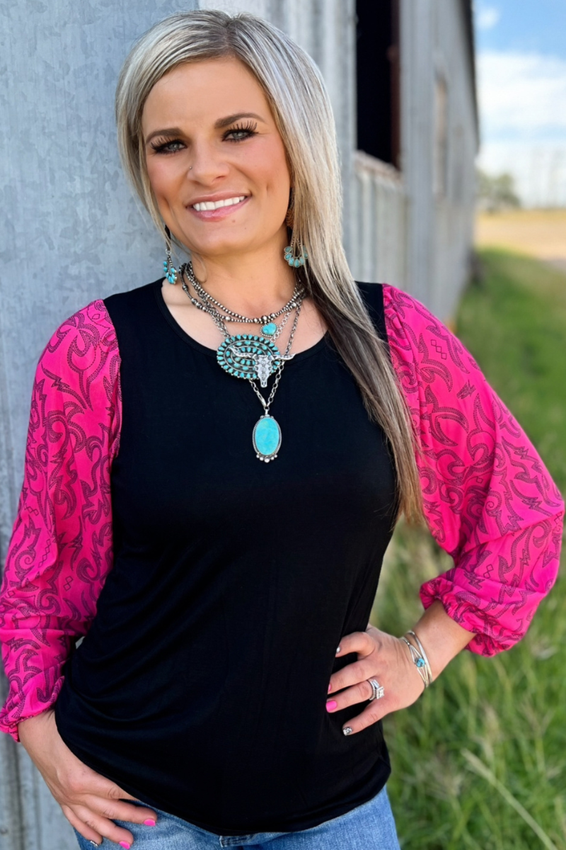 Black top with pink bubble sleeves