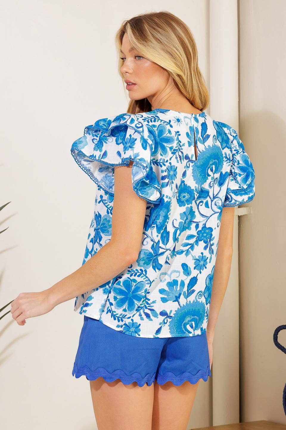 Off white & blue printed top with flutter sleeves