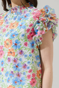Floral mock neck ruffle blouse
