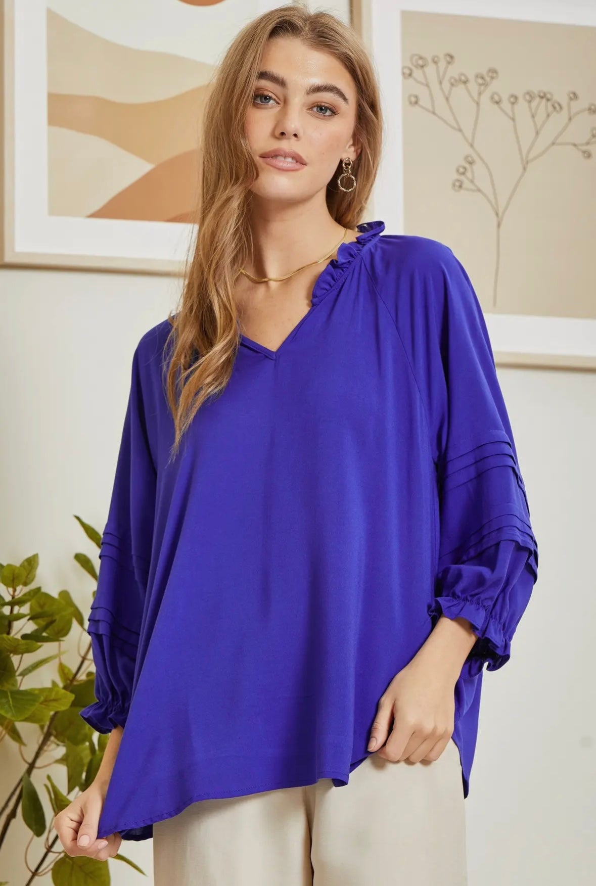 Royal blue top with ruffle neck detail