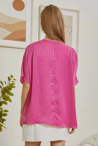 Hot pink top with a v-neckline