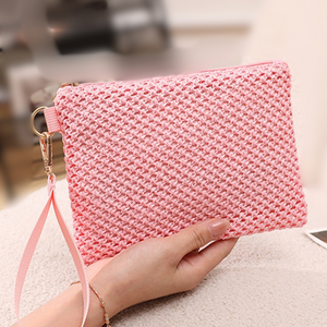 Pink woven wrist strap purse