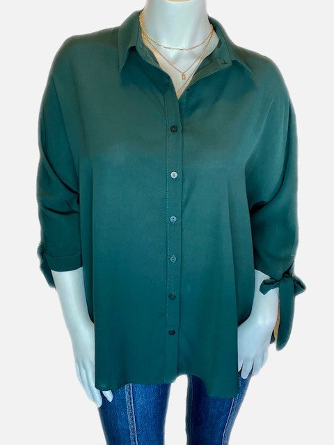 Green button down top with bows on the sleeve
