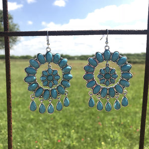 Turquoise dangle earrings with flower concho